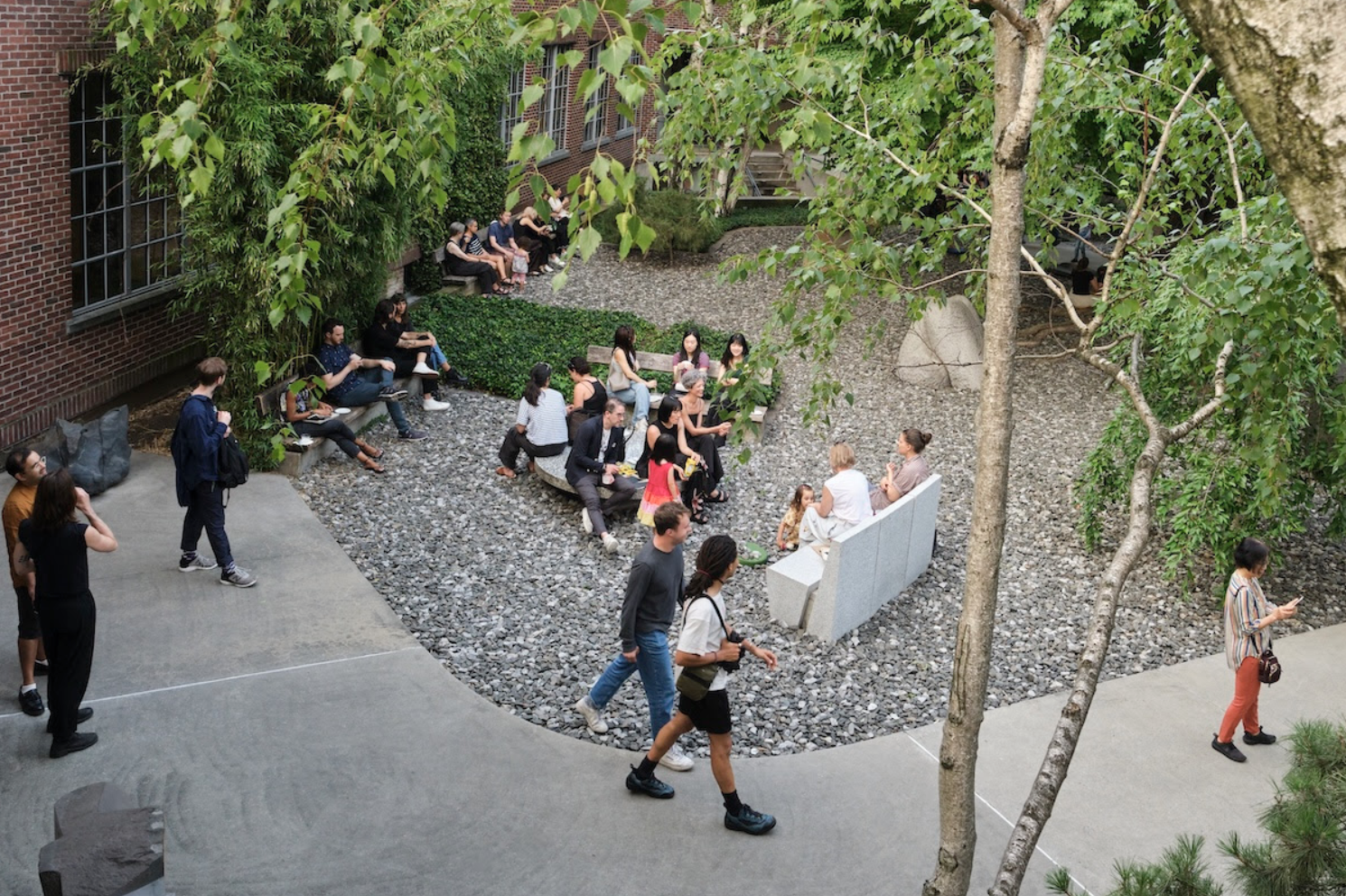 people sitting in the noguchi courtyard