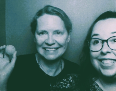 Image of two people and ping pong ball