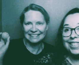 Image of two people and ping pong ball