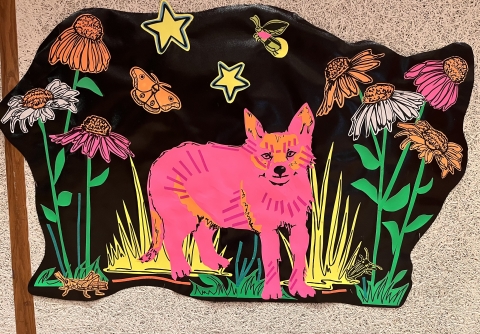 We have a neon display of a forest that lights up in the dark!