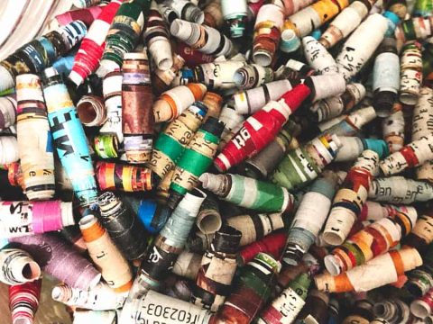 Make colorful beads out of old magazines!