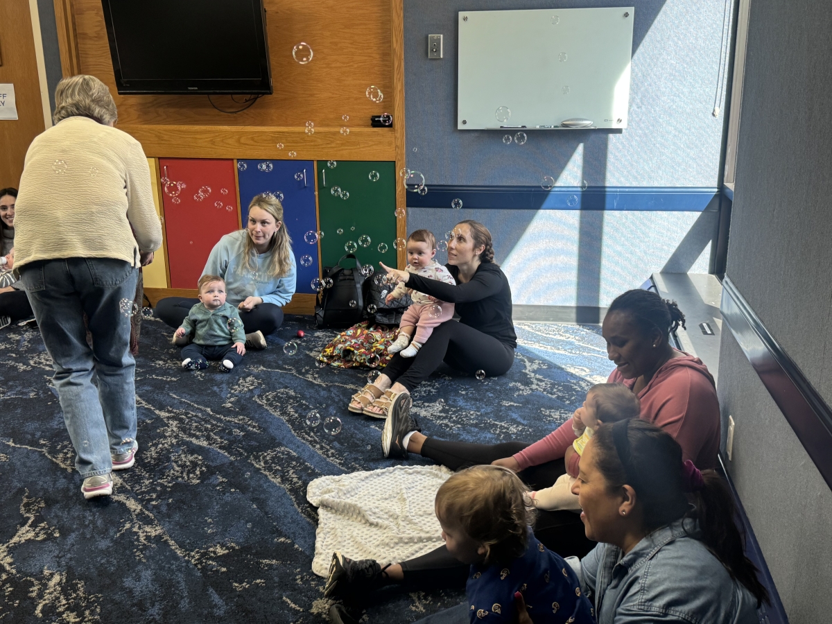 Group of adults and kids with bubbles