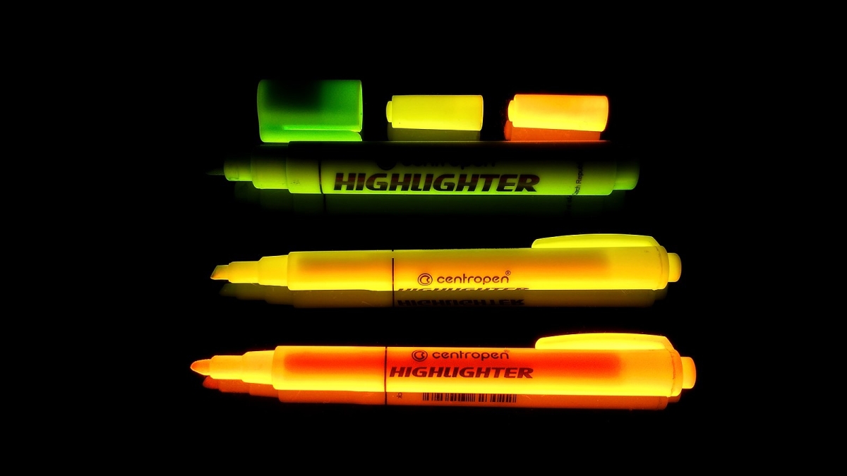 Highlighter markers glow under a black light